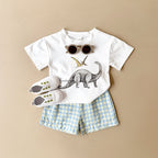 Conjunto Bebê Dinossauro | Camiseta + Shorts Xadrez Unissex 6M-3 Anos